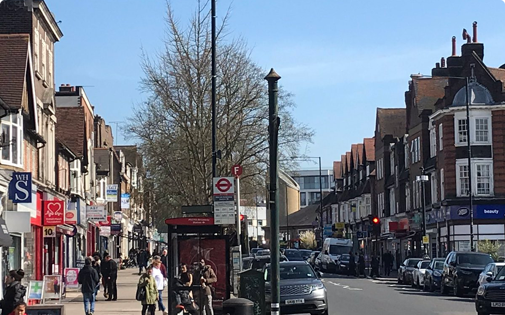 Busy street view with shops and pedestrians