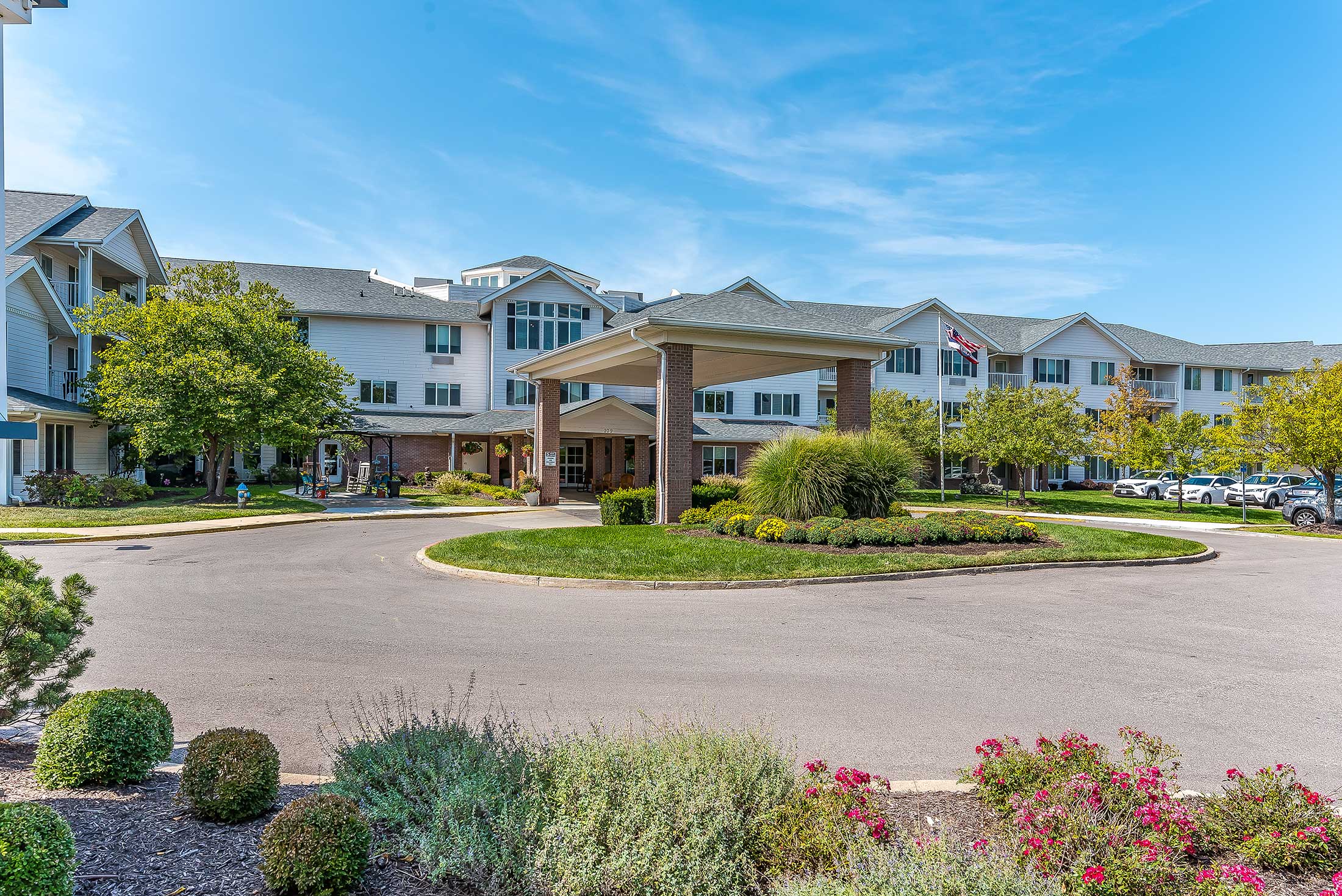 Exterior view of Solstice Senior Living with landscaped gardens and entrance