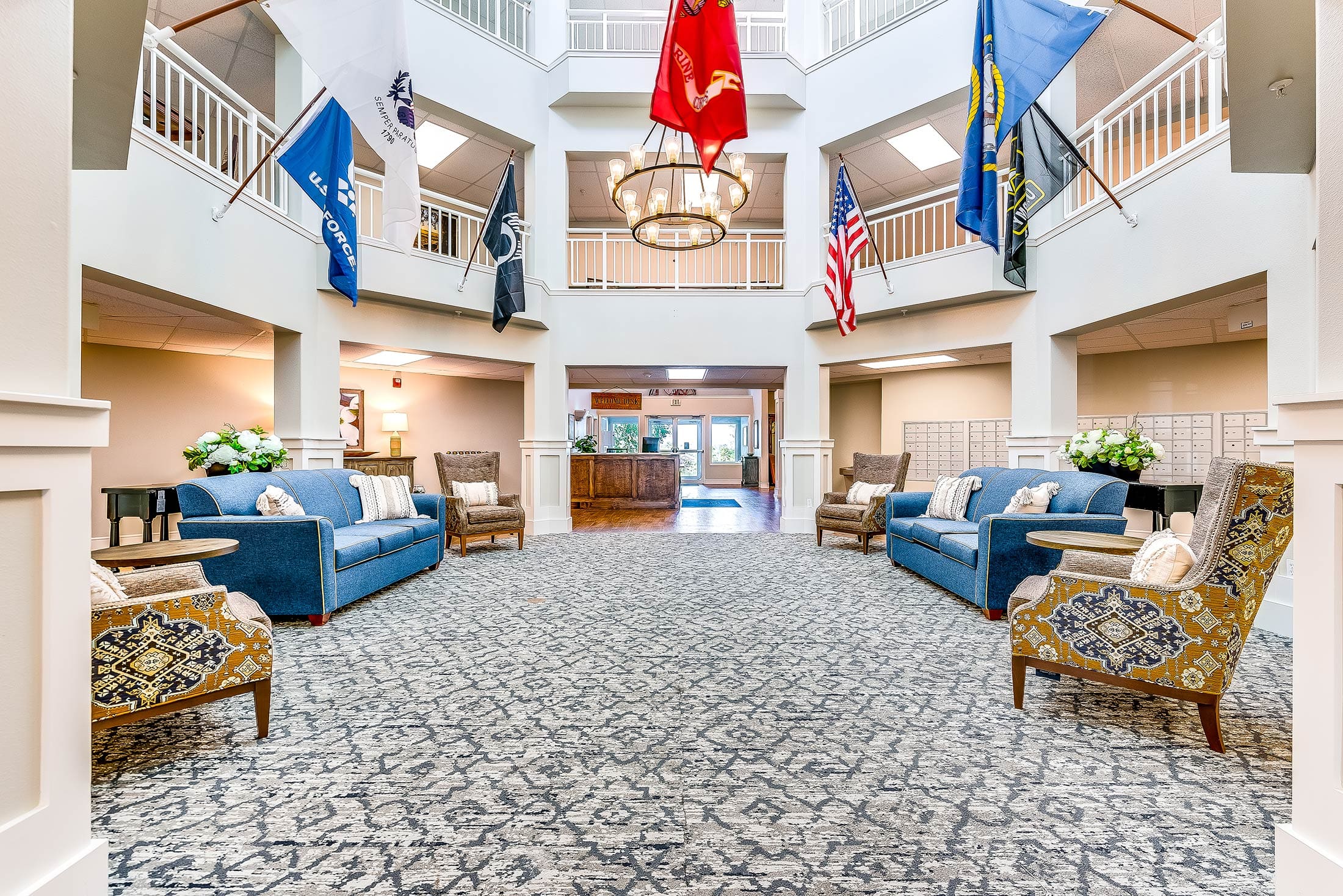 Bright common area with seating and flags