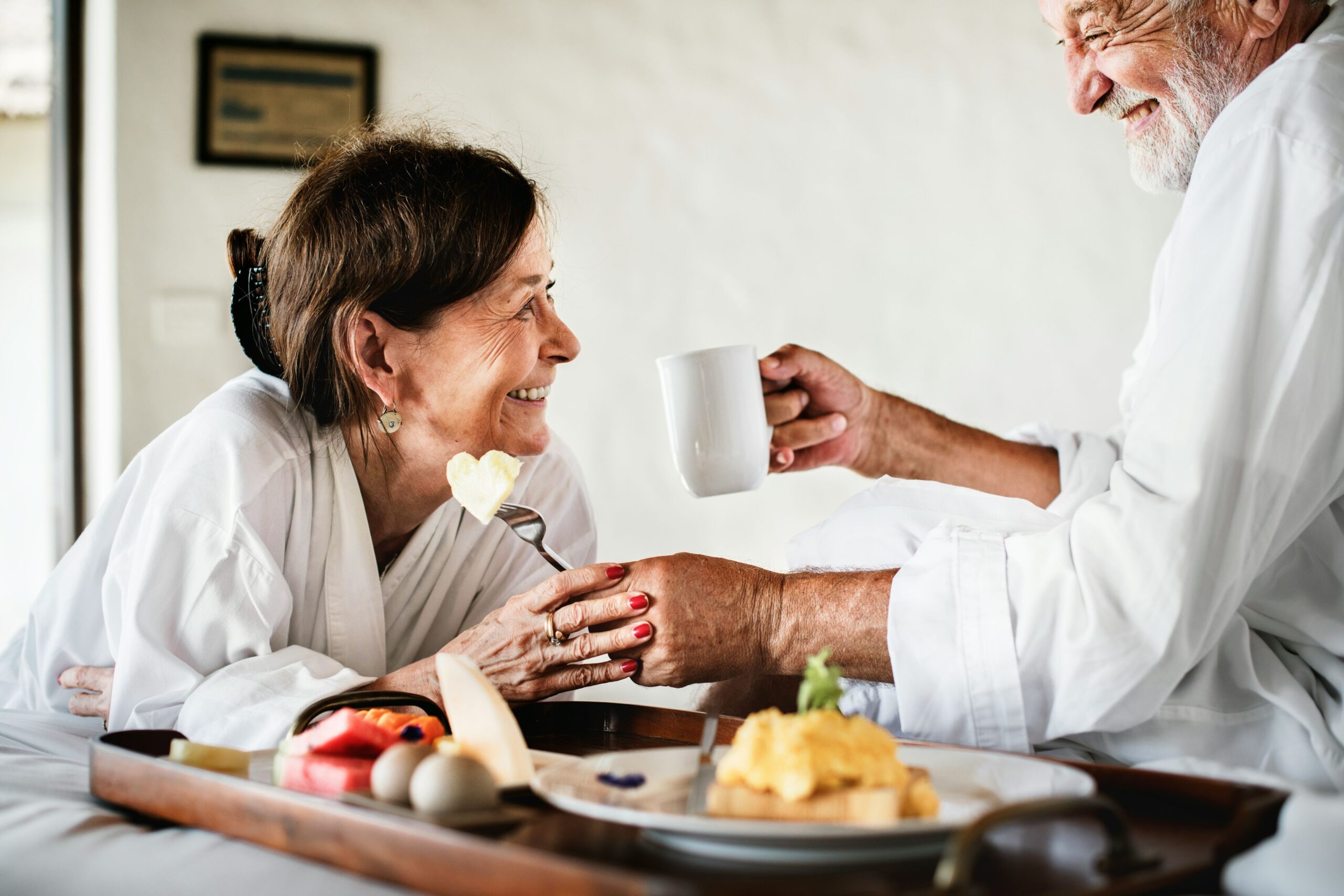 Two residents enjoying breakfast in their room