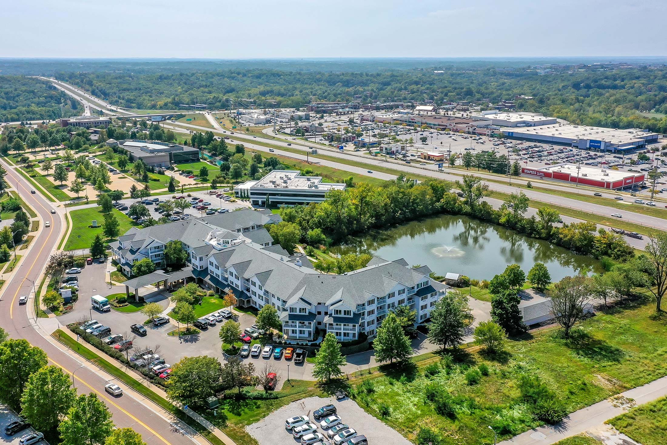 Aerial view of Solstice Senior Living campus with pond