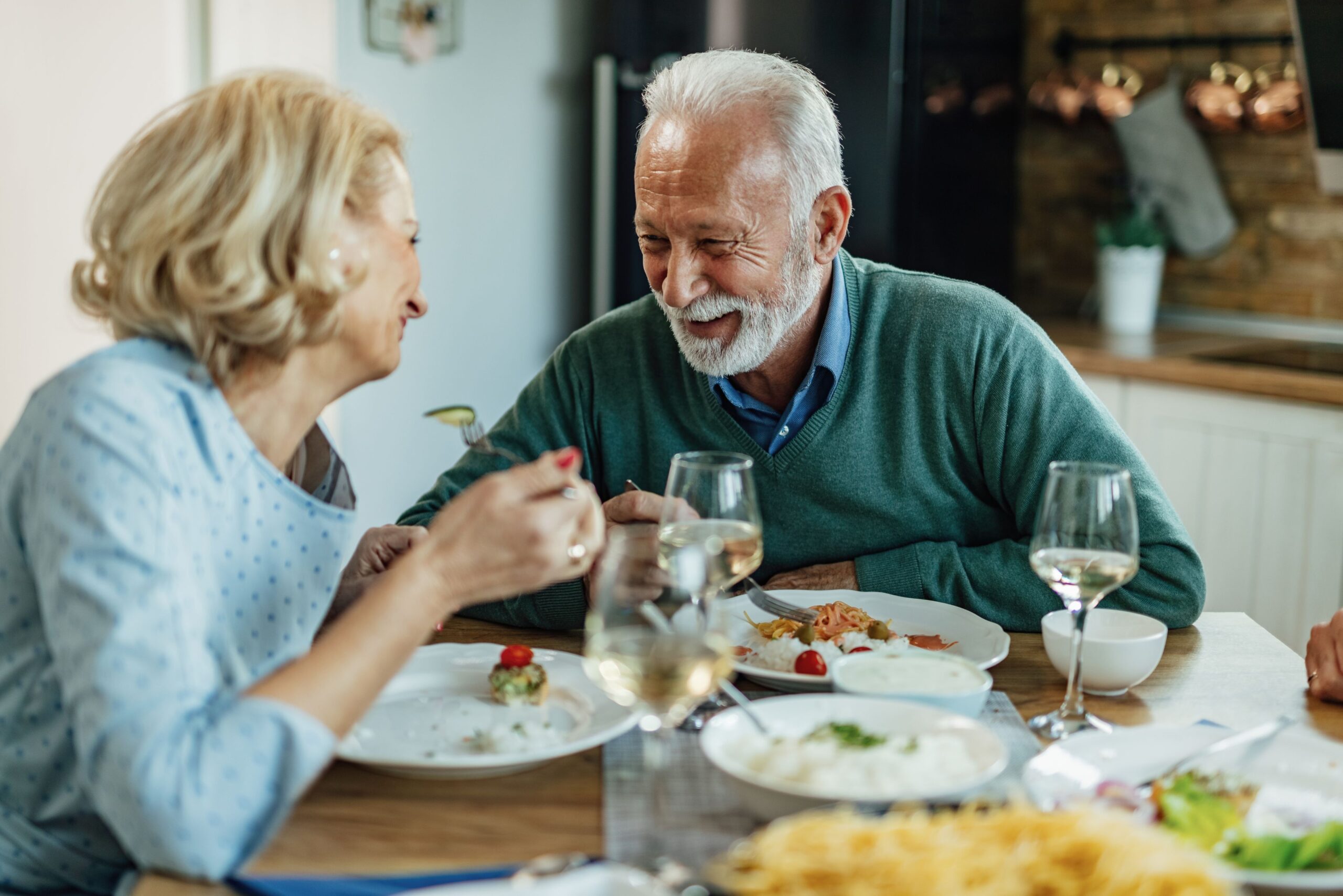 Seniors enjoying a meal together at a dining table