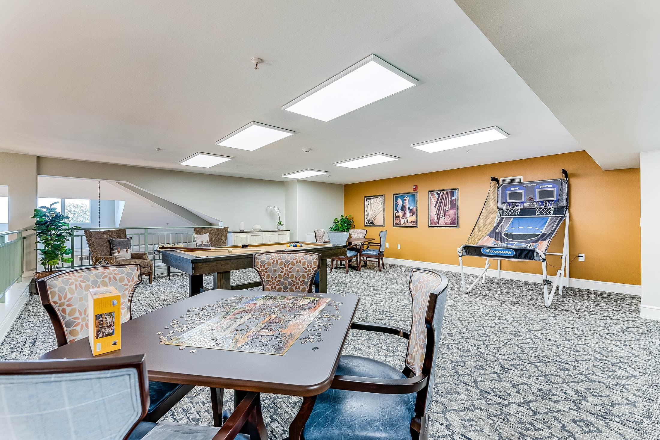 Bright common area with games and seating