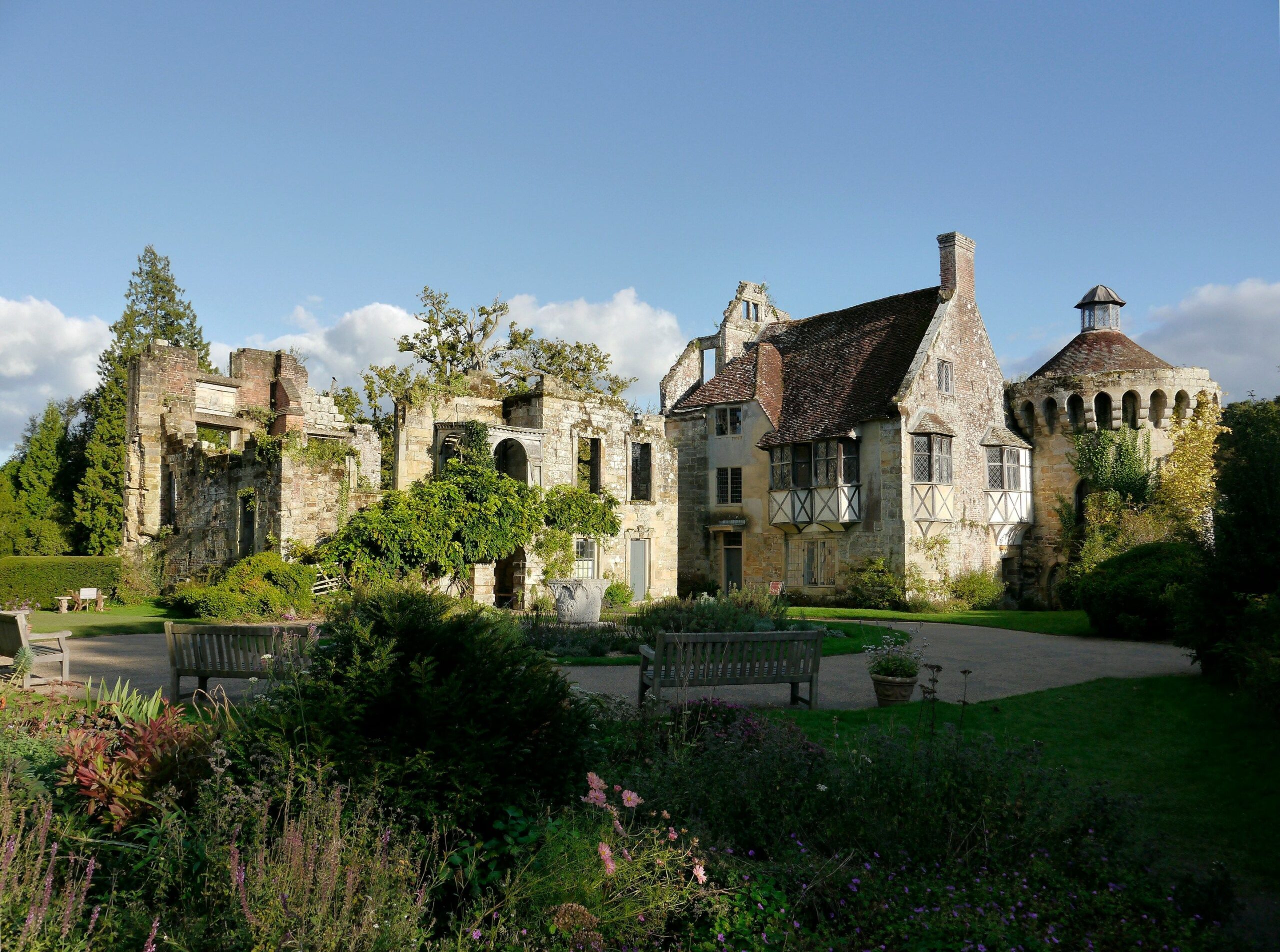 Exterior view of an assisted living facility with gardens