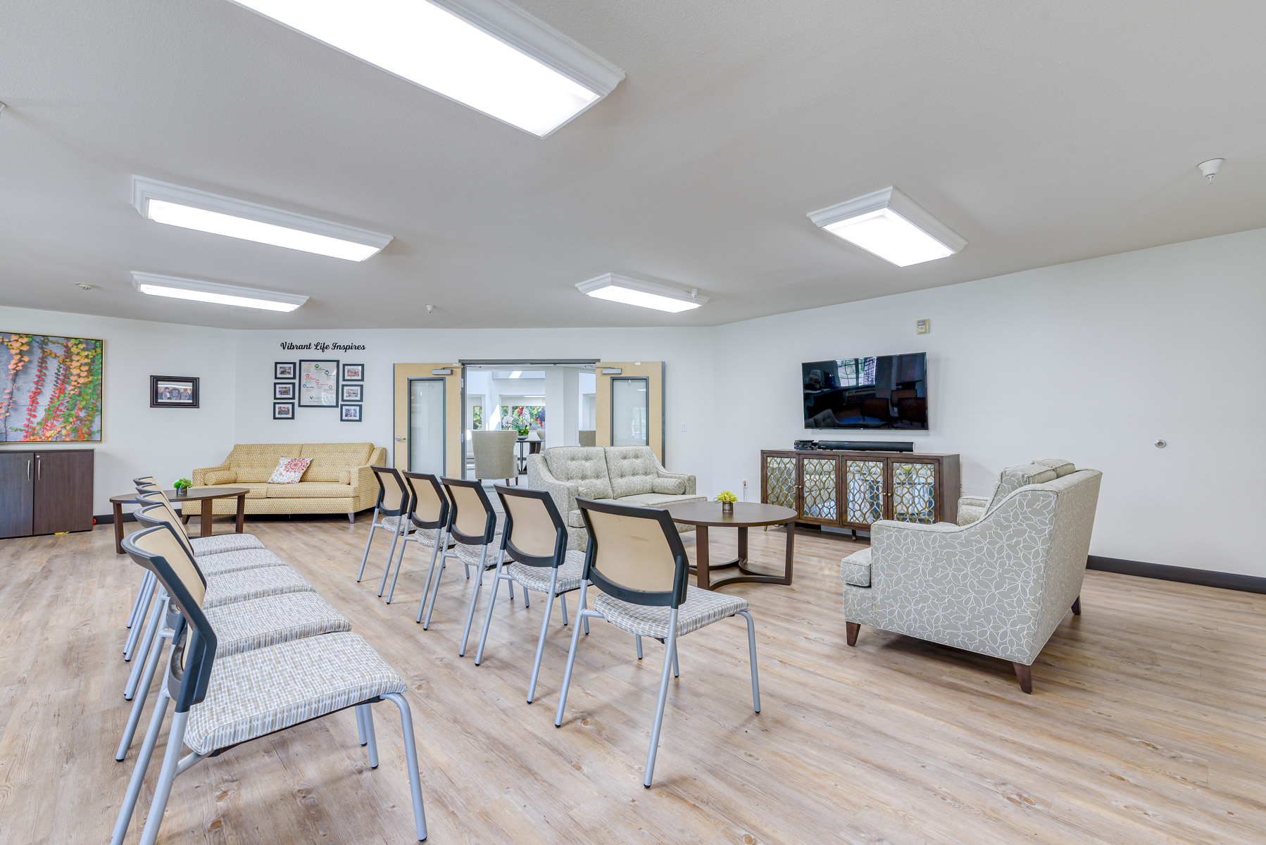 Bright common area with seating and television