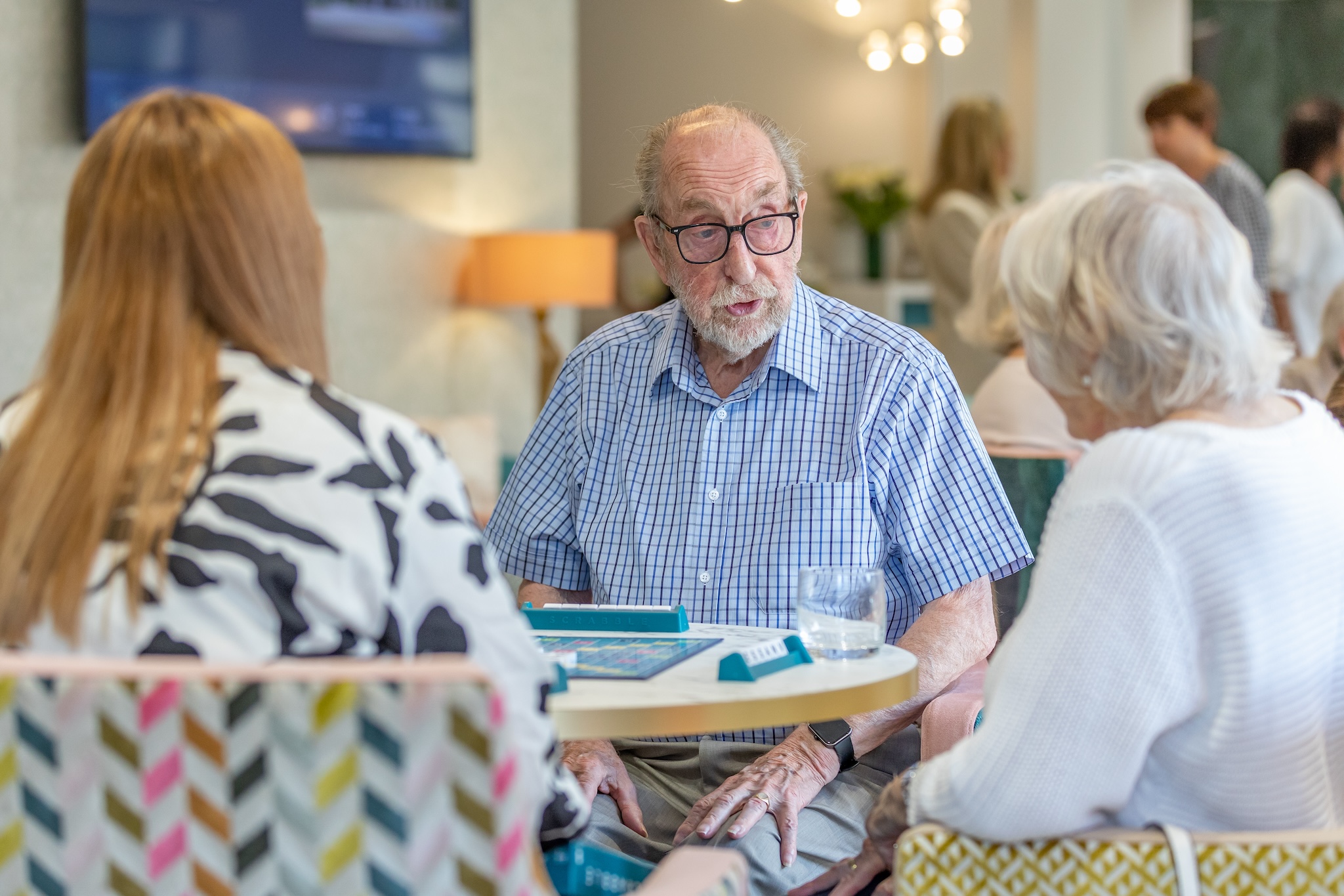 Residents engaging in a conversation in a common area