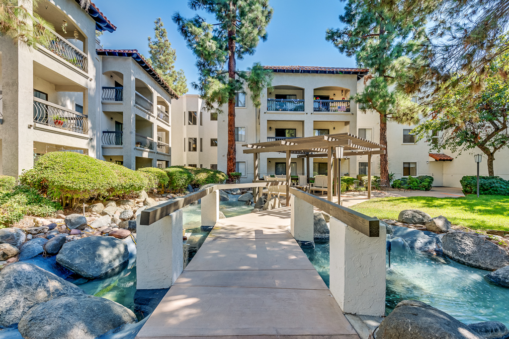 Pathway leading to a beautifully landscaped outdoor area