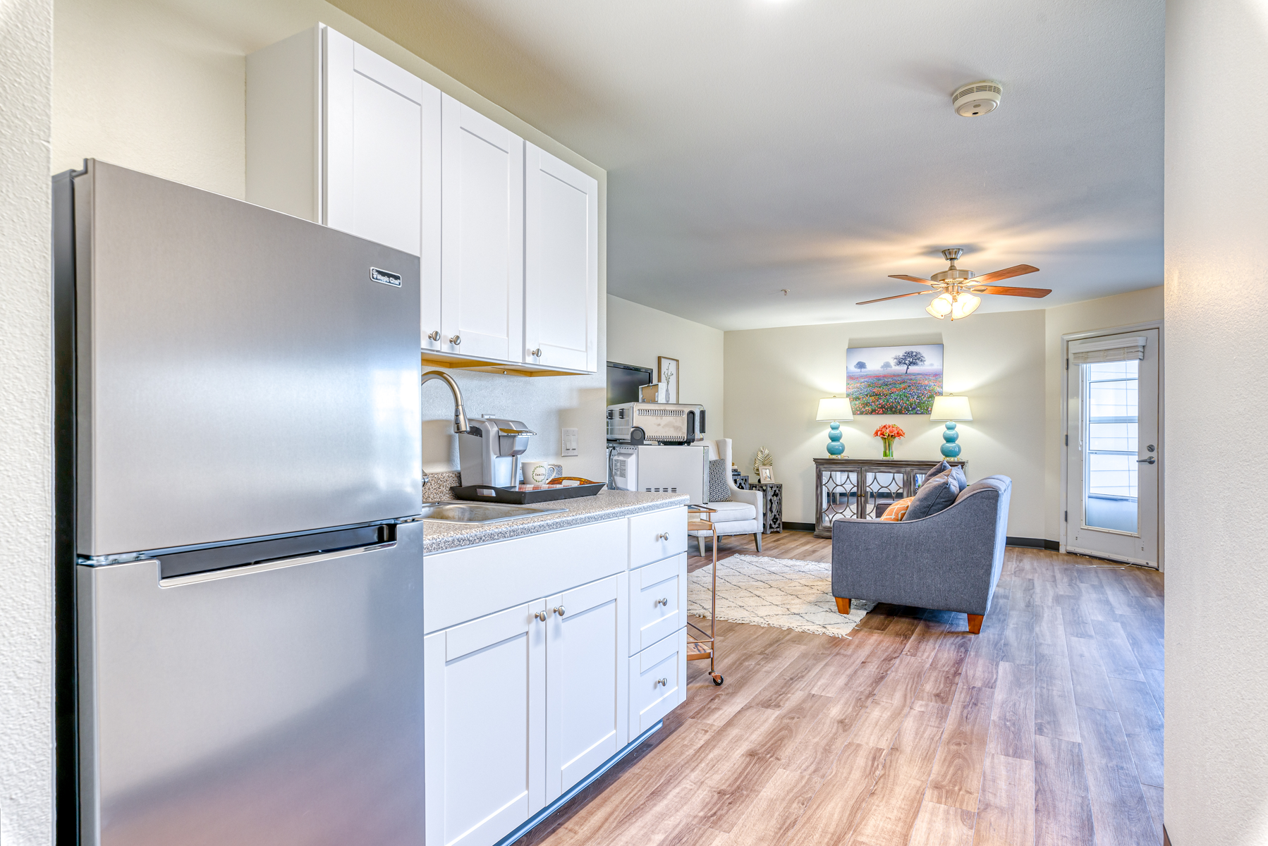 Bright and welcoming kitchen area in a resident unit