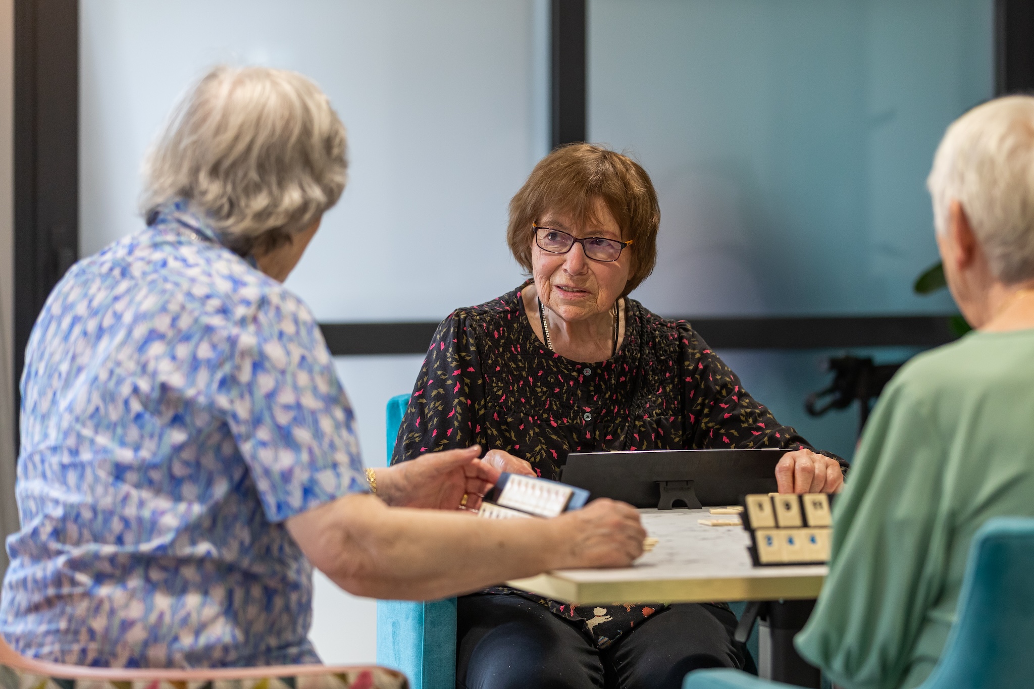 Residents engaged in a bingo game during an activity session