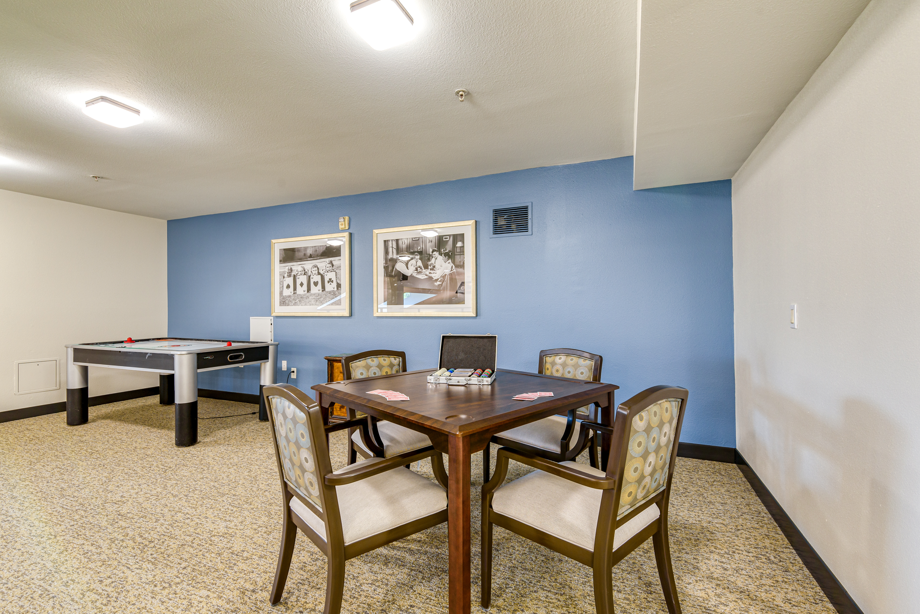 Common area with a table and pool table