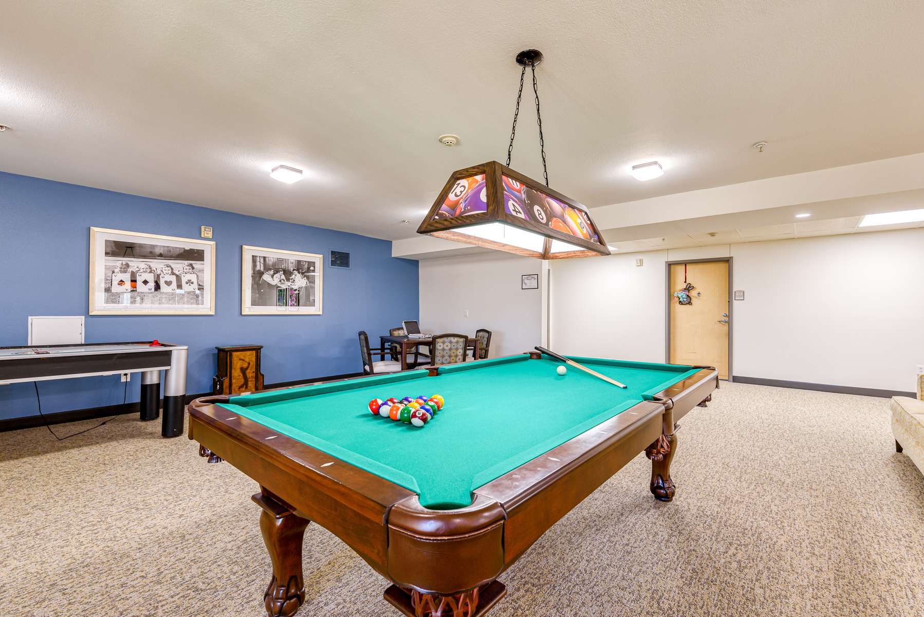 Interior view of a game room with a pool table