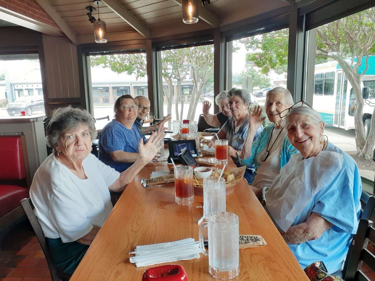 Residents enjoying a meal together at a dining table