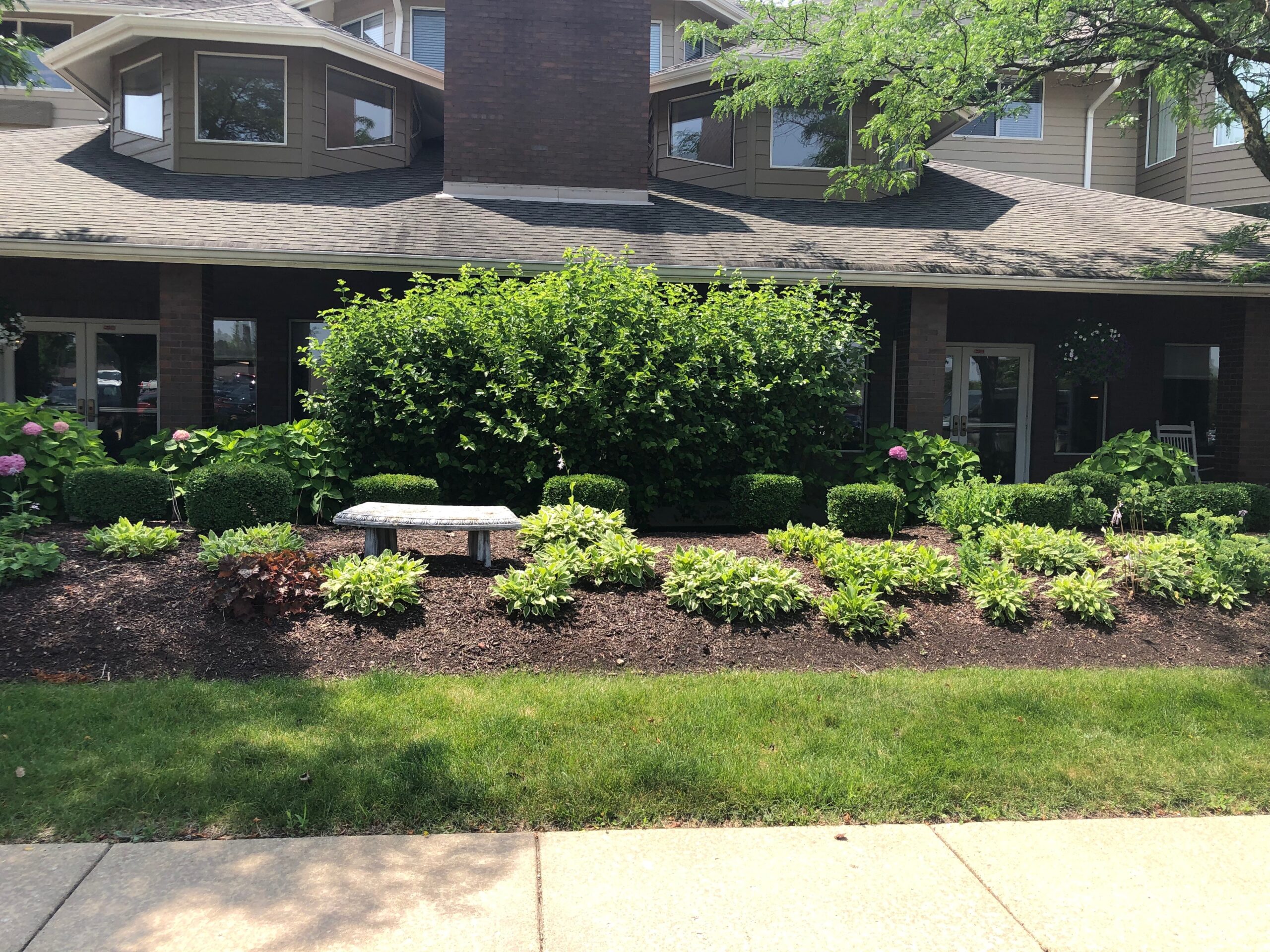 Well-maintained garden area at facility entrance
