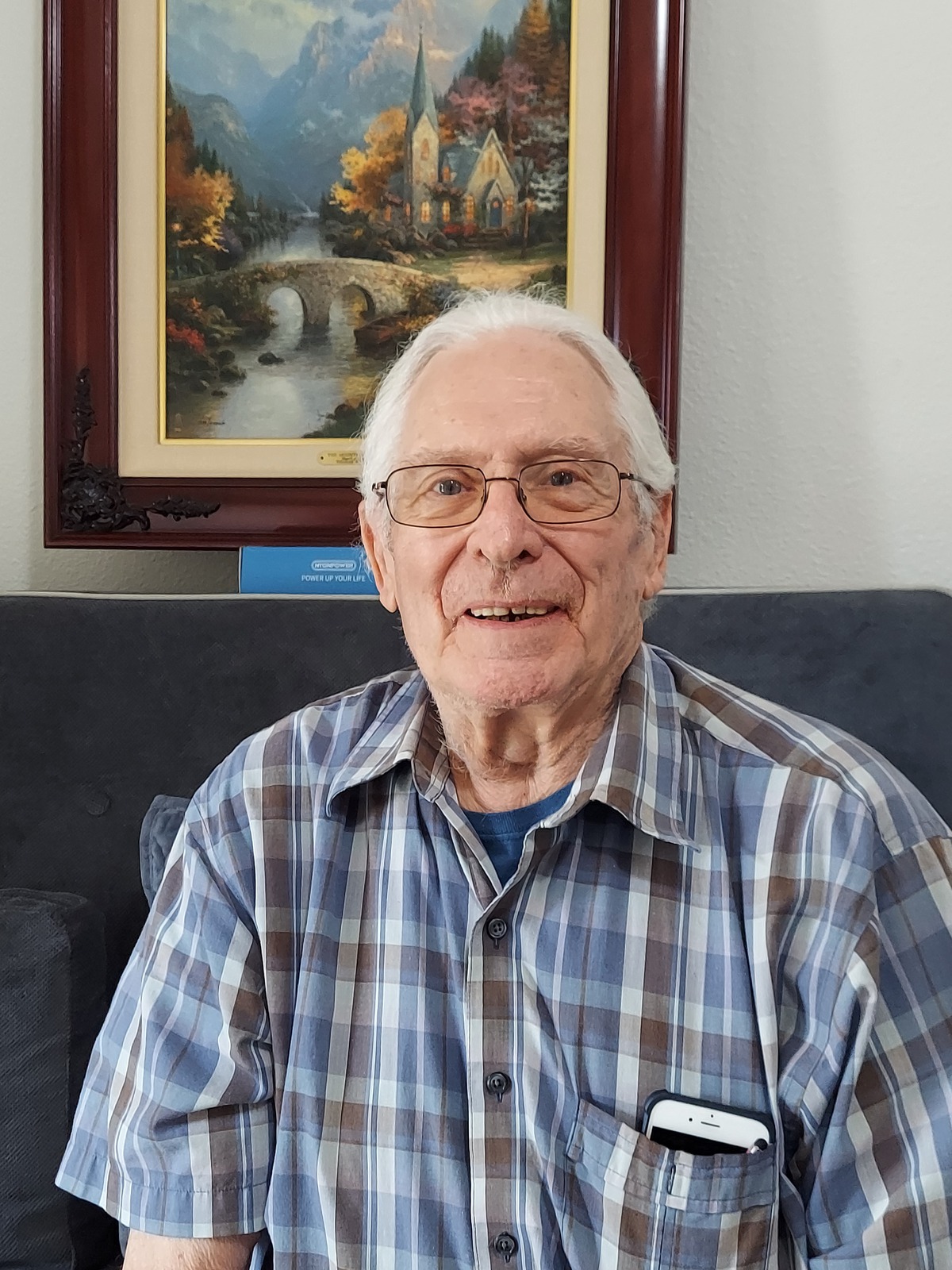 A smiling resident in a comfortable indoor setting