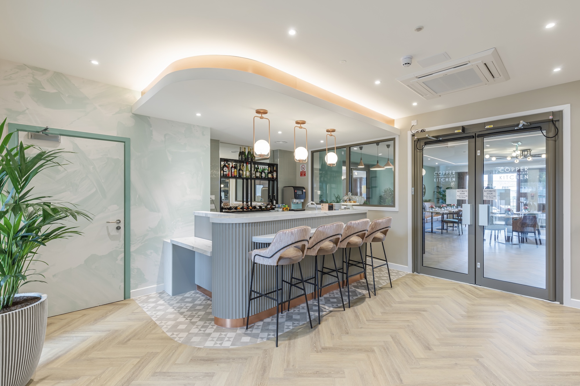 Interior view of a modern communal space with bar seating
