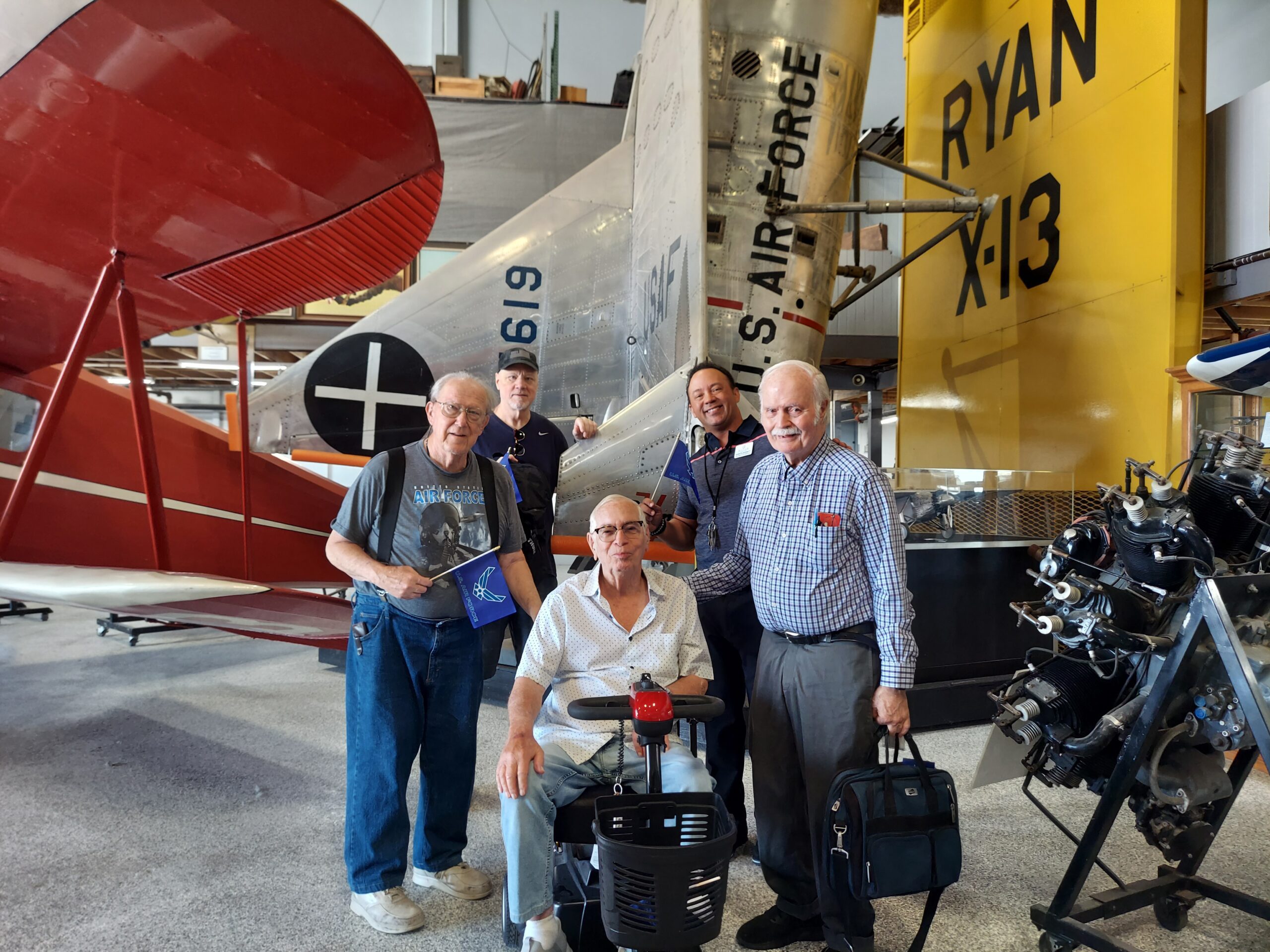 Residents enjoying a group activity with vintage airplanes