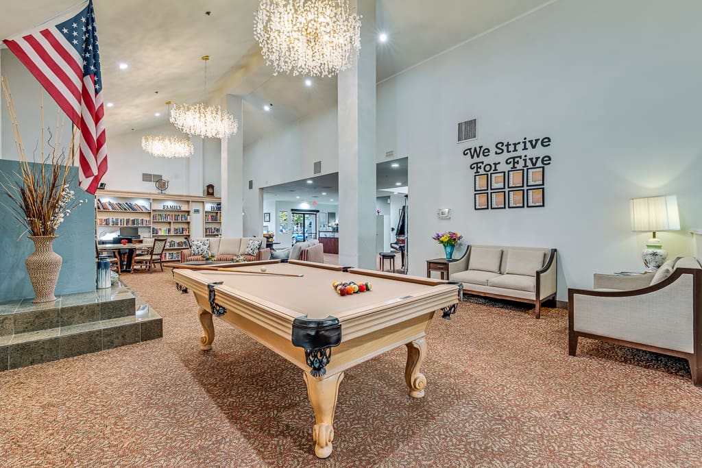 Interior lounge area with a pool table and decor