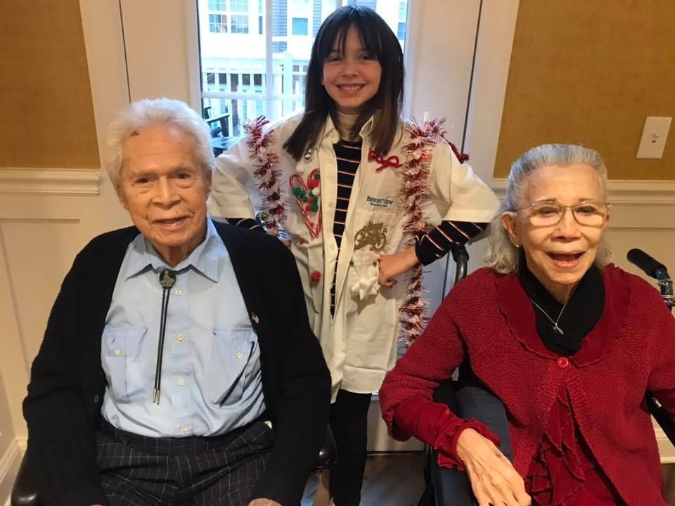 Residents and a child celebrating in a common area
