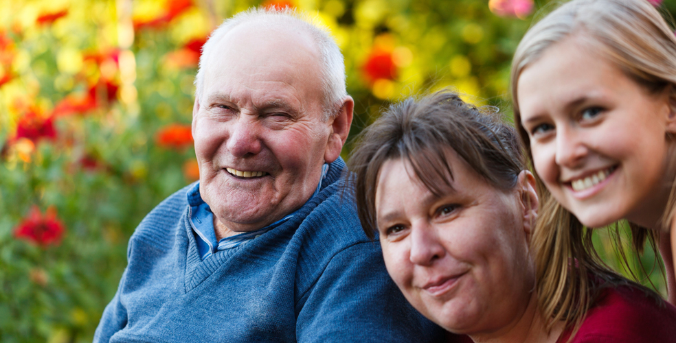 Residents and staff enjoying time in a garden