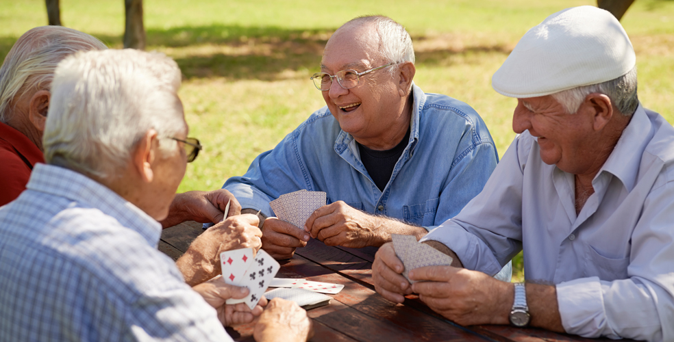 Residents enjoying a game of cards outdoors