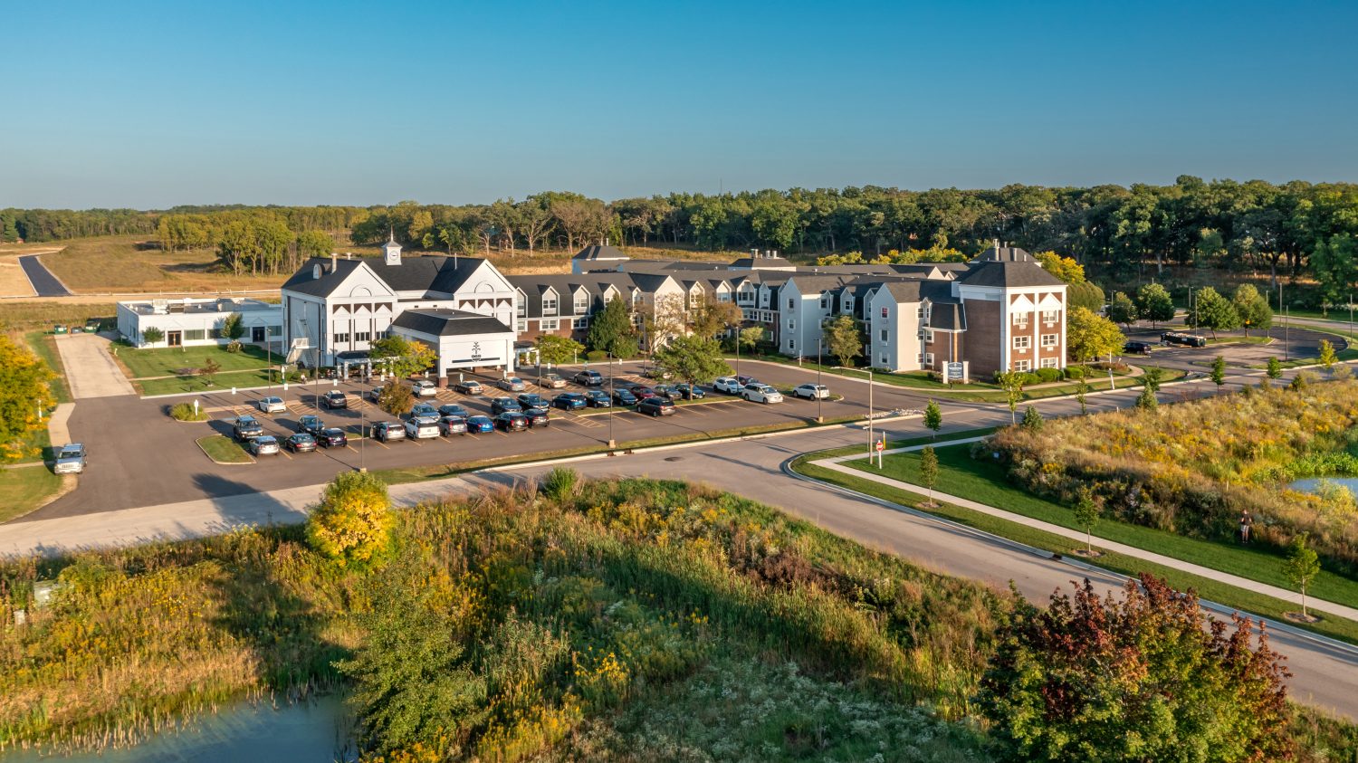 Aerial view of the Glass Peaks Senior Living facility and parking area