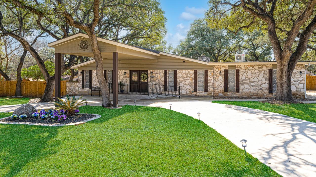 Exterior view of Premier Assisted Living facility with landscaping