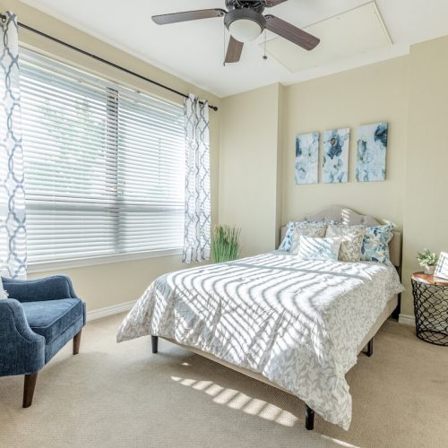 Bright and cozy resident bedroom with decor.