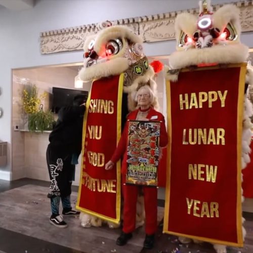 Residents celebrating Lunar New Year with a lion dance.
