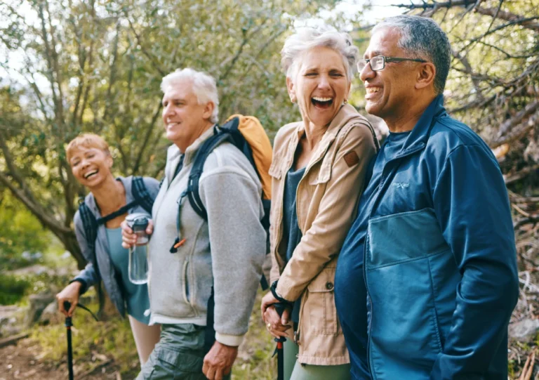Group of seniors enjoying a hike outdoors.