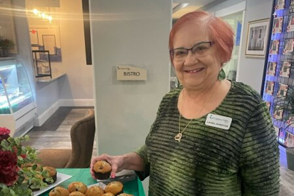 Resident enjoying muffins in a common area.