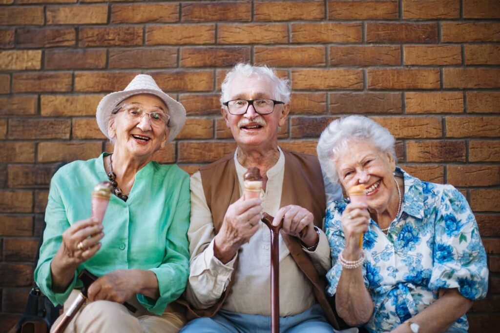 Three seniors enjoying ice cream together
