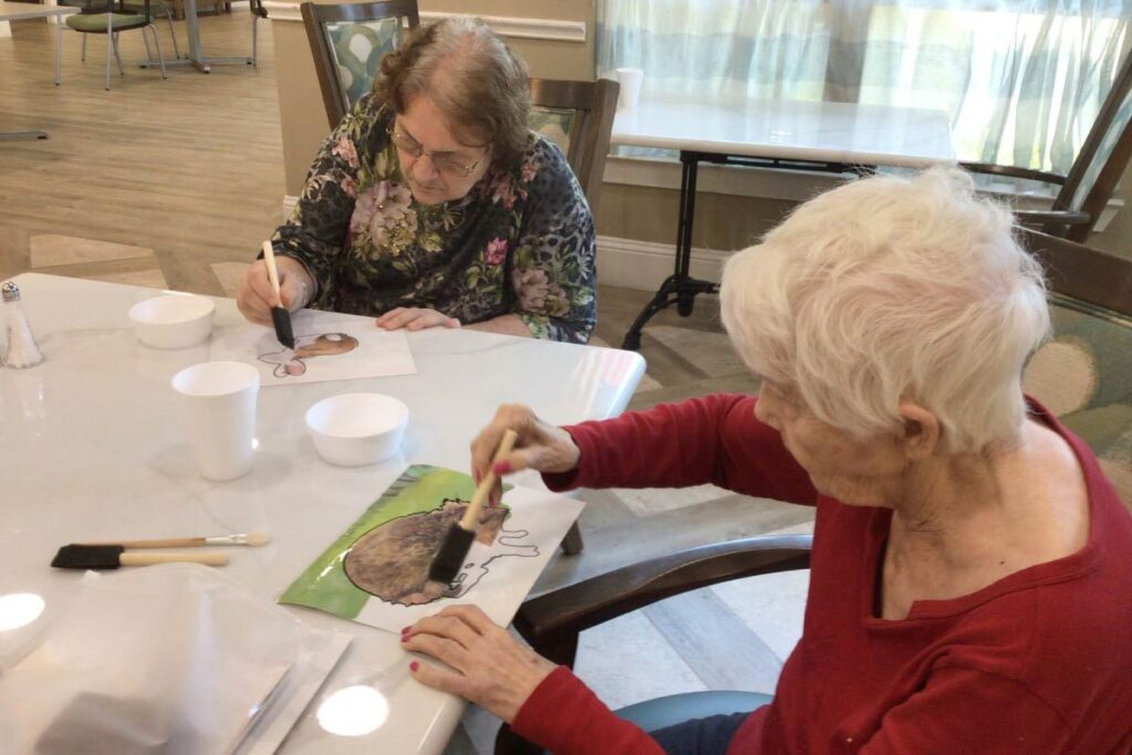 Residents participating in an arts and crafts activity.