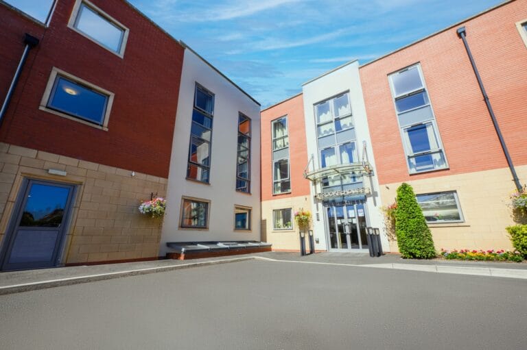 Exterior view of Melton House facility entrance.