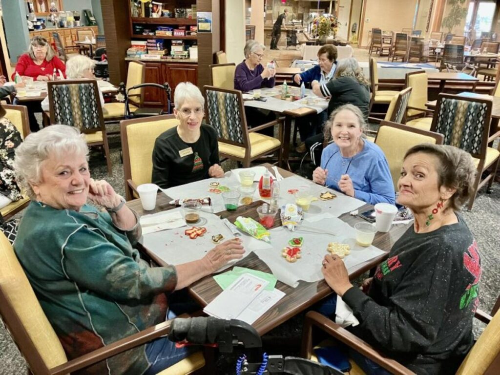 Residents enjoying a meal together in a dining area.