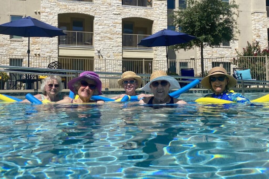 Residents enjoying time by the swimming pool