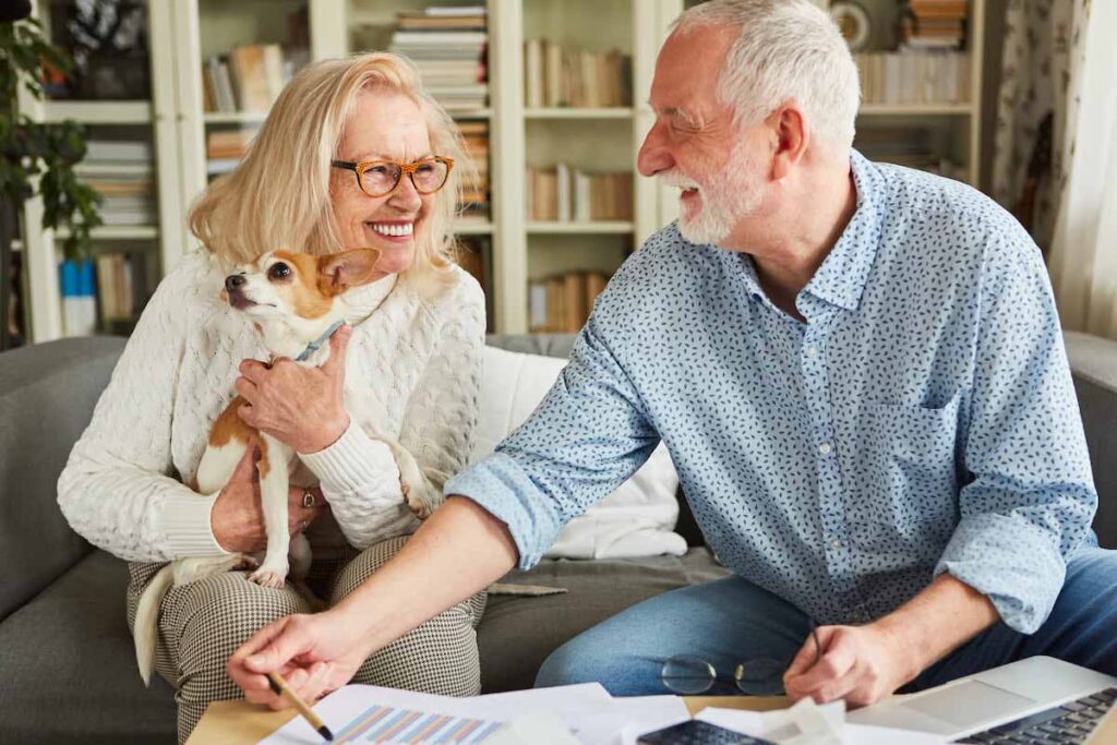 Senior residents enjoying time with a small dog.