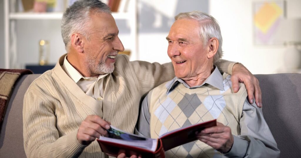 Two seniors enjoying a book together