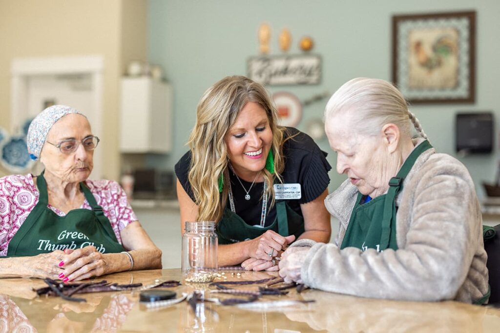 Residents participating in an activity with staff.