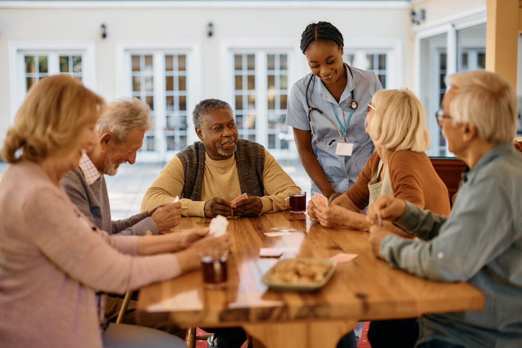 Residents engaging with staff in a common area