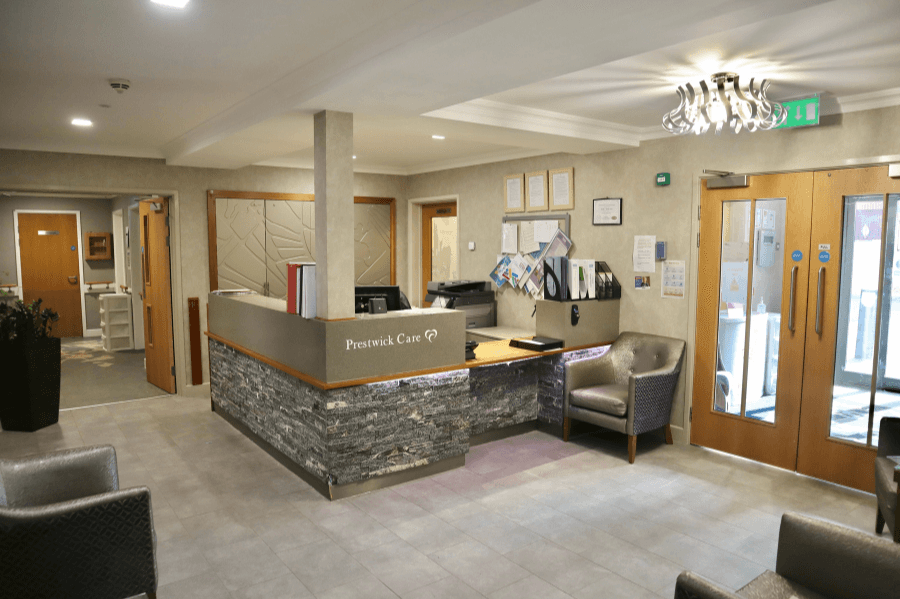 Reception area with seating and front desk.