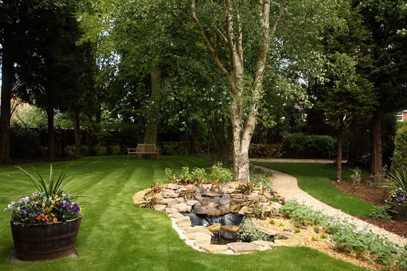 Well-maintained garden with a small water feature