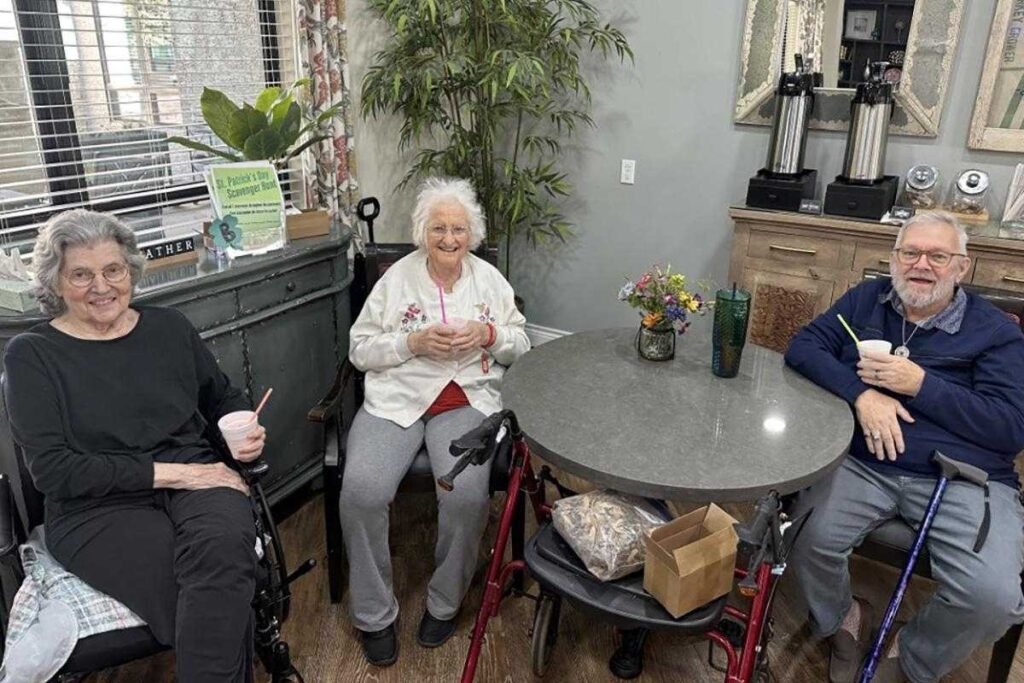 Residents enjoying refreshments in a common area.