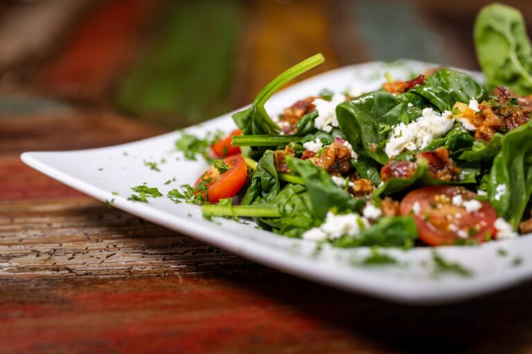 Fresh salad with spinach, tomatoes, and feta cheese