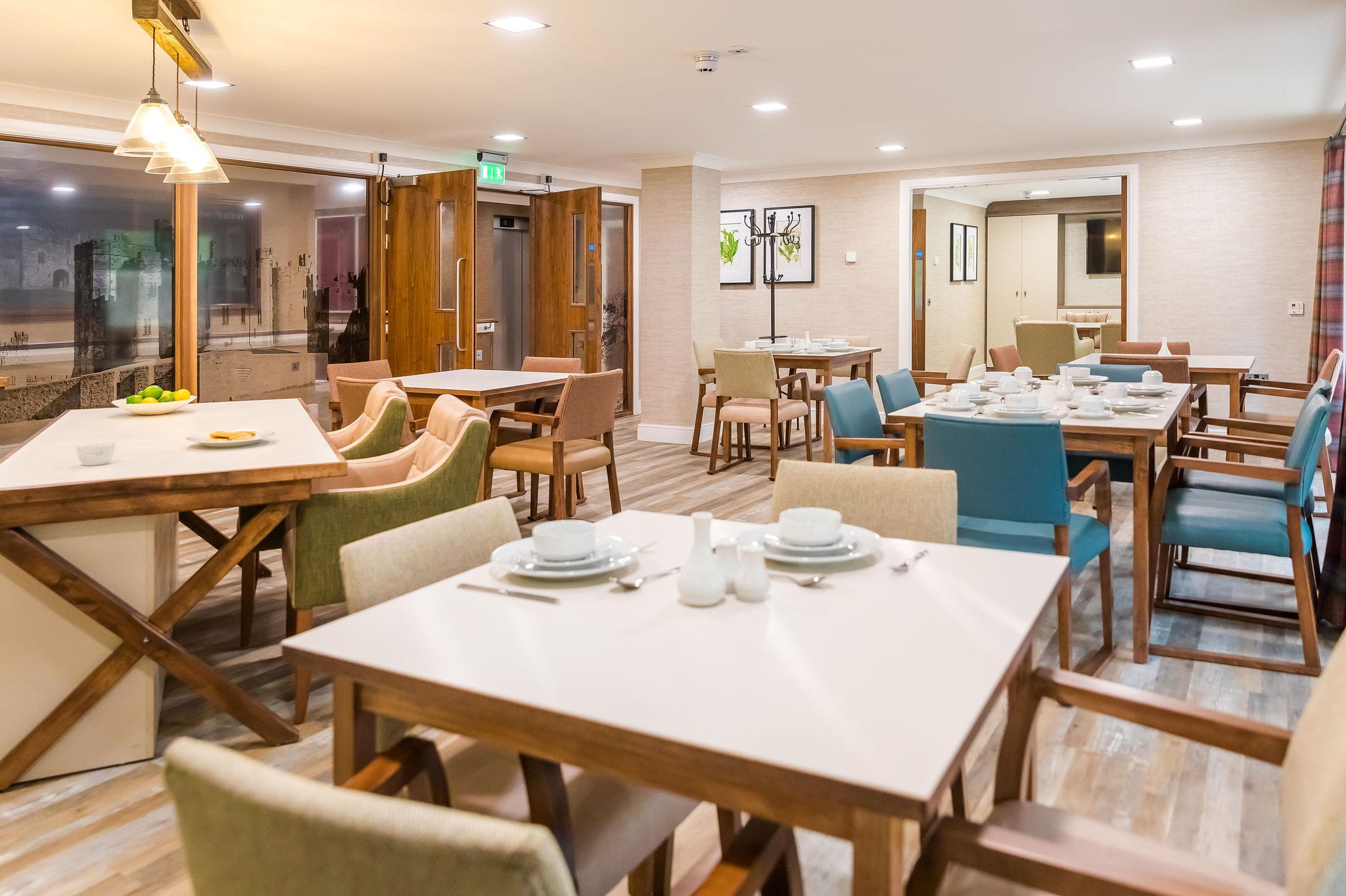 Dining area with tables set for meals.