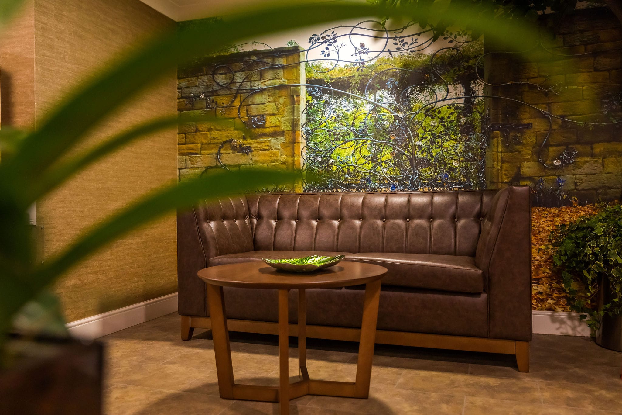 Cozy common area with a brown sofa and decorative wall