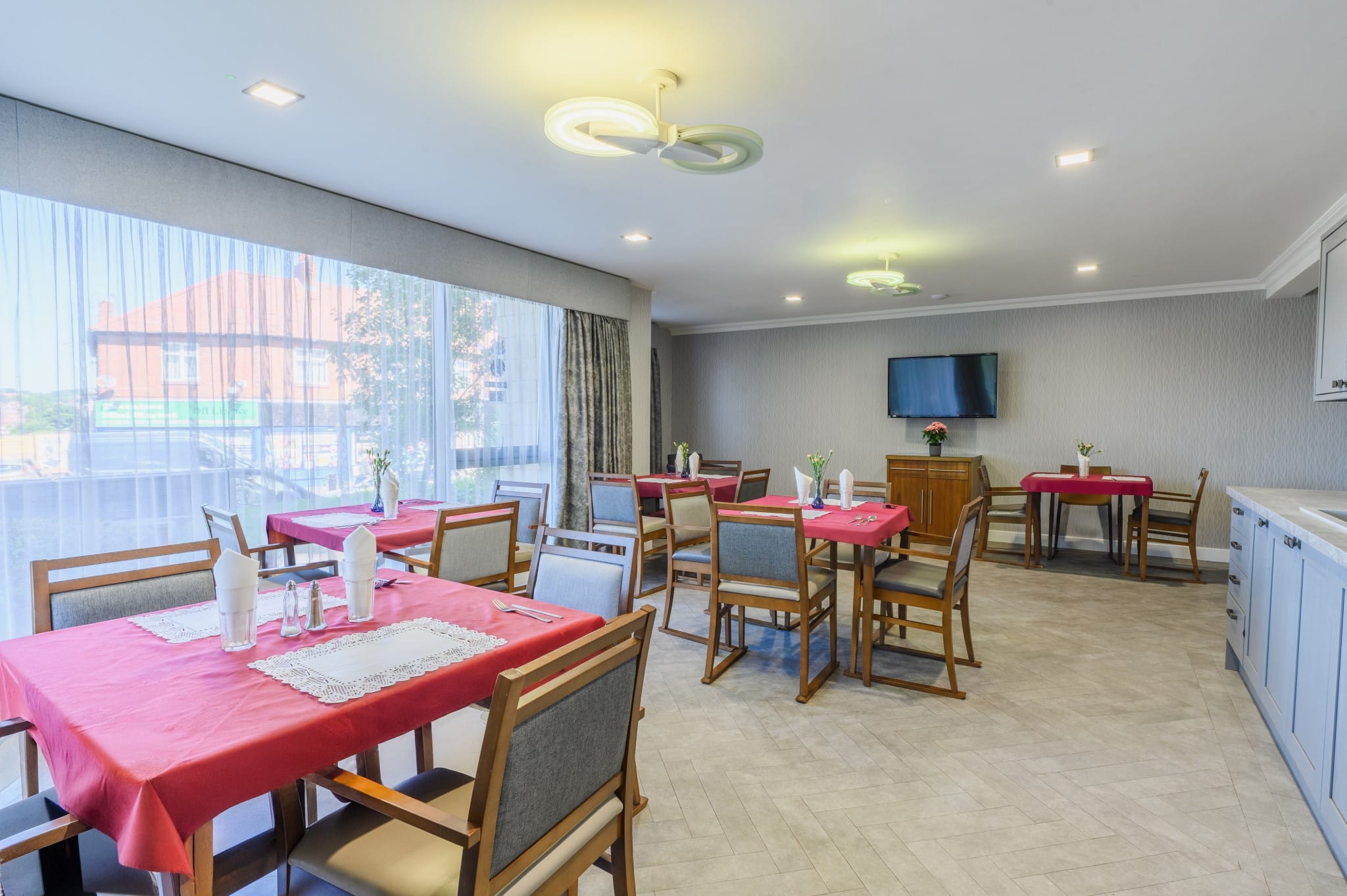 Tastefully arranged dining room with tables and chairs.