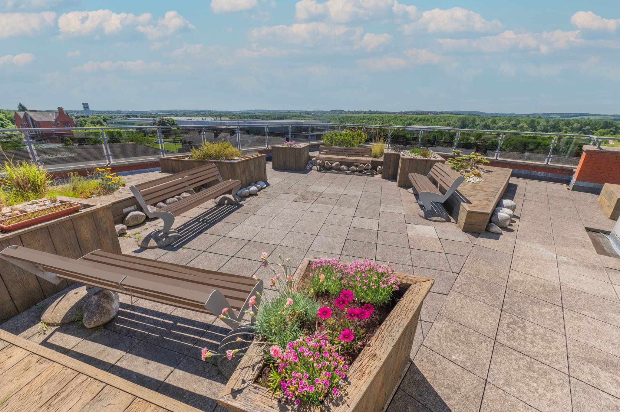 Outdoor terrace with seating and flowers