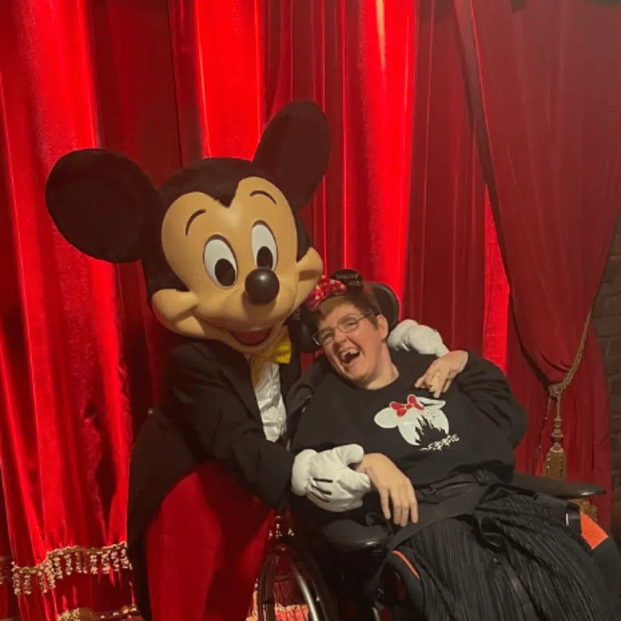 Resident celebrating with a character performer.