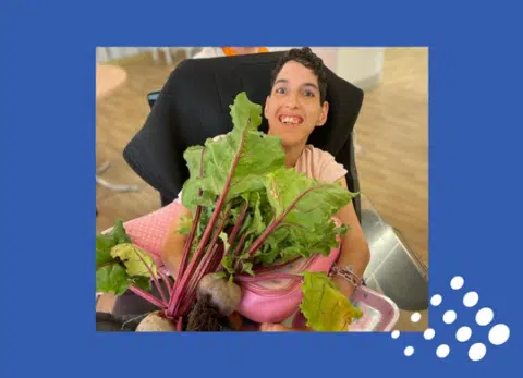Resident enjoying fresh beets in a bright interior