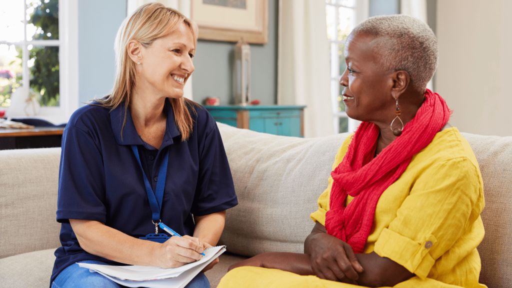 Caregiver interacting with a resident in a common area.
